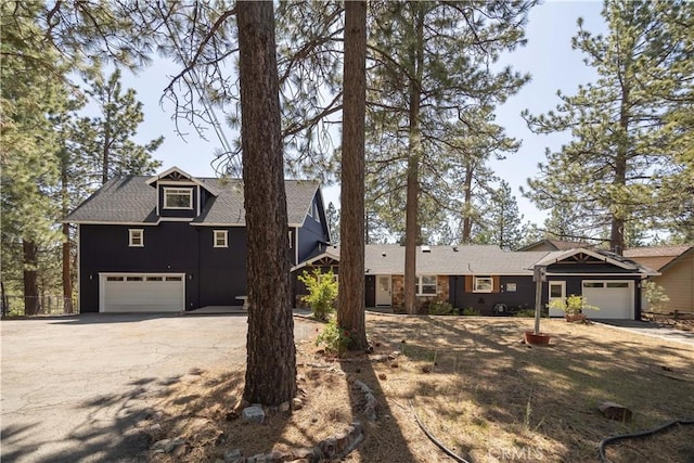 188 S Finch Dr, Big Bear Lake, CA 92315 - view of front facade with driveway and a shingled roof