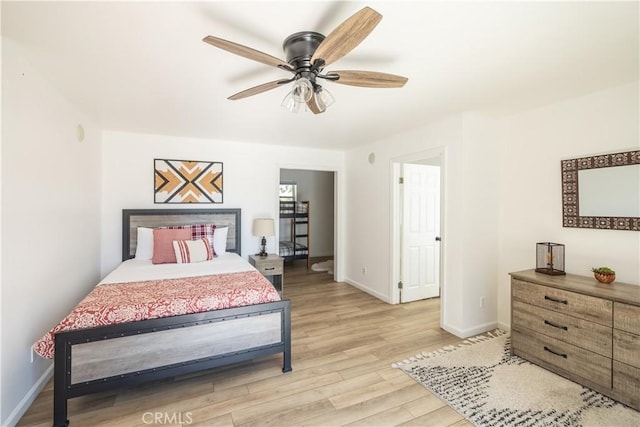 bedroom featuring light wood-type flooring and ceiling fan