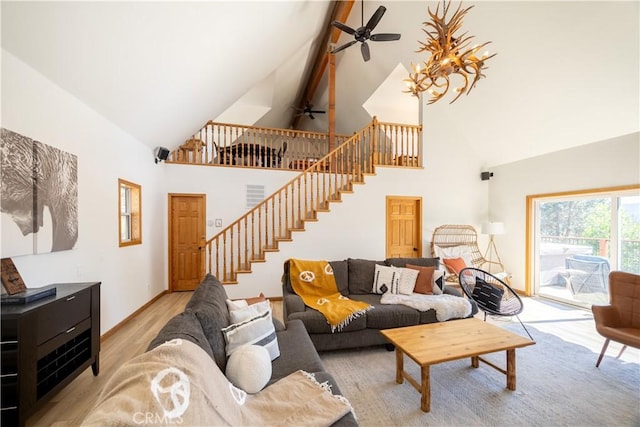 188 S Finch Dr, Big Bear Lake, CA 92315 - living room with high vaulted ceiling, ceiling fan, stairway, light wood finished floors, and beamed ceiling