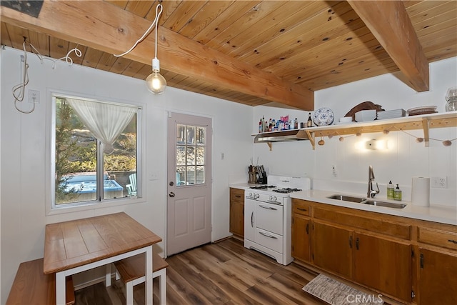 kitchen with sink, pendant lighting, white gas range, and wooden ceiling