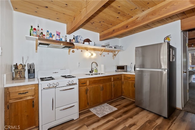 kitchen featuring stainless steel appliances, wood ceiling, sink, beamed ceiling, and dark hardwood / wood-style floors