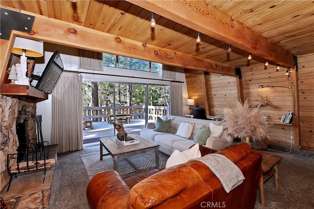 carpeted living room featuring wooden walls, wood ceiling, a stone fireplace, and beam ceiling