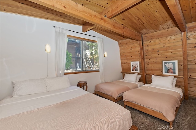 bedroom with wooden walls, lofted ceiling with beams, and wooden ceiling