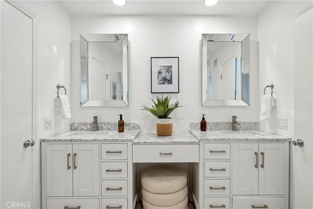 bathroom featuring double vanity and a sink