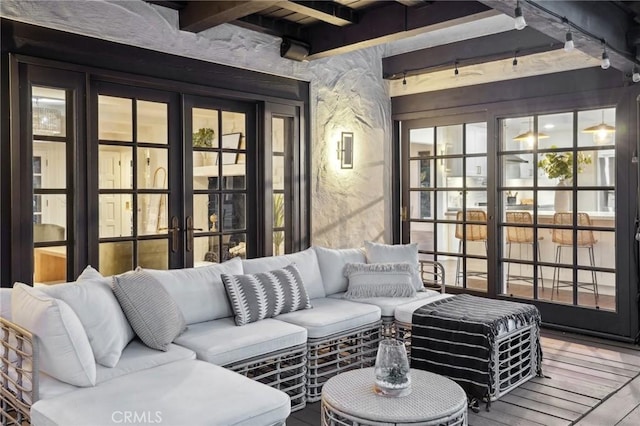 interior space with french doors and beamed ceiling