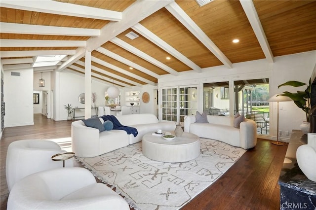 living area featuring wood ceiling, vaulted ceiling with skylight, dark wood-style flooring, and visible vents