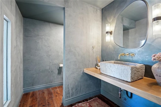 bathroom featuring a sink and wood finished floors