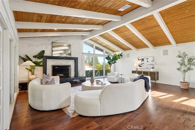 living area featuring dark wood finished floors, vaulted ceiling with beams, visible vents, a high end fireplace, and wooden ceiling