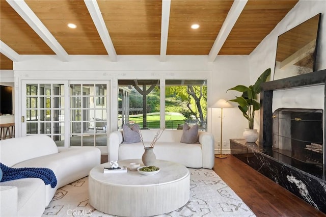 living room with a high end fireplace, wooden ceiling, recessed lighting, and wood finished floors