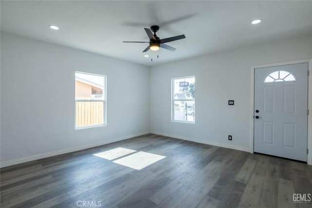 entryway featuring ceiling fan and dark wood-type flooring