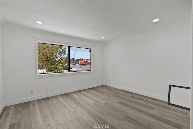 unfurnished room with light hardwood / wood-style flooring