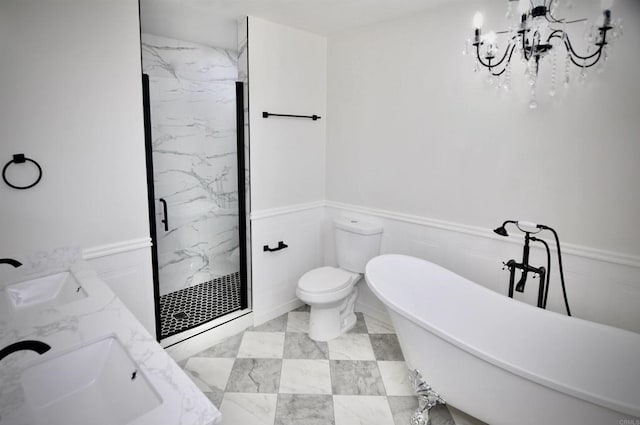 full bathroom with shower with separate bathtub, vanity, a notable chandelier, and toilet