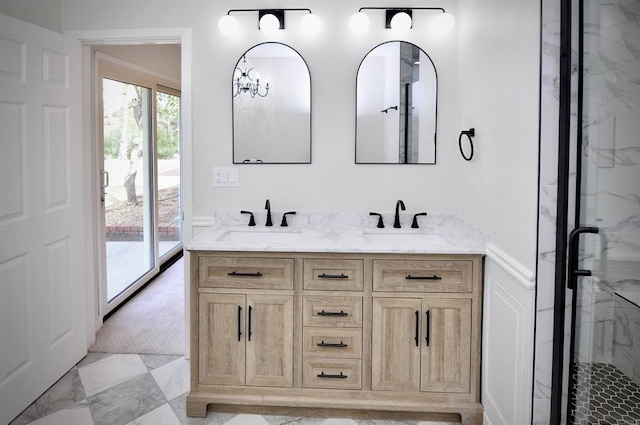 bathroom featuring vanity and an enclosed shower