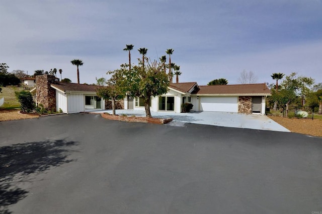 ranch-style home featuring a garage