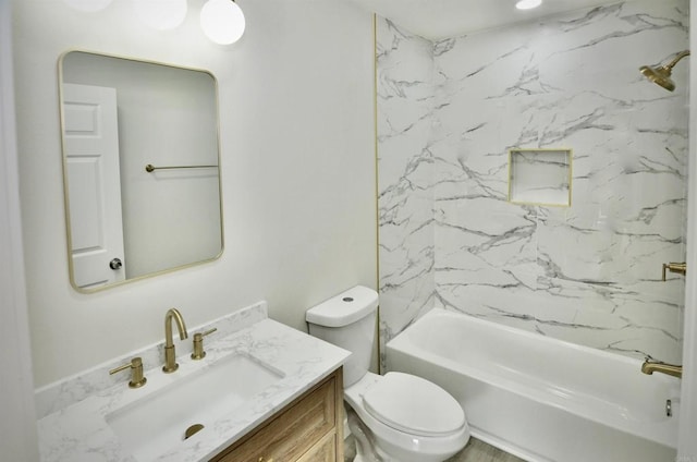 full bathroom with tiled shower / bath combo, vanity, and toilet