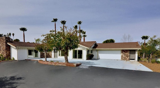 844 Hamilton Ln, Fallbrook, CA 92028 - view of front facade featuring a tiled roof, an attached garage, driveway, board and batten siding, and fence