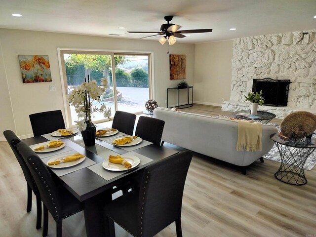 844 Hamilton Ln, Fallbrook, CA 92028 - dining space with light wood-type flooring, a ceiling fan, a stone fireplace, baseboards, and recessed lighting