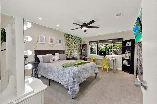 bedroom with ceiling fan and light colored carpet