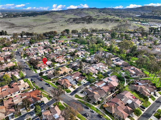 birds eye view of property featuring a mountain view