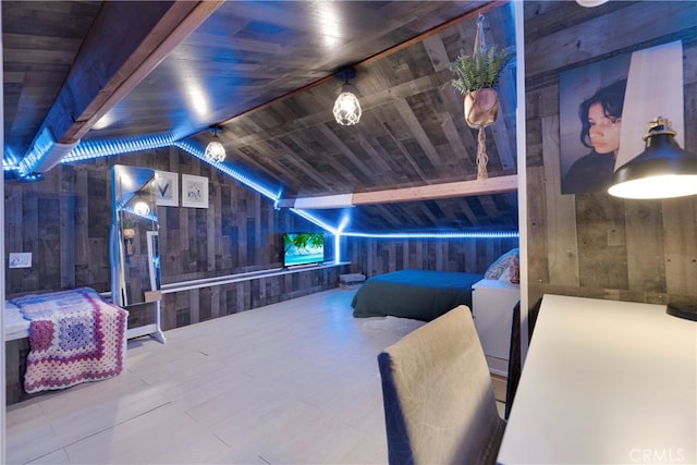 bedroom with wooden ceiling, hardwood / wood-style floors, lofted ceiling with beams, and wooden walls