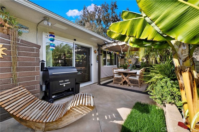 view of patio featuring a grill