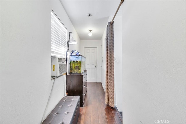 hallway featuring dark hardwood / wood-style flooring