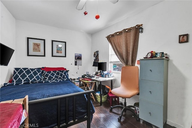 bedroom with ceiling fan and dark hardwood / wood-style floors