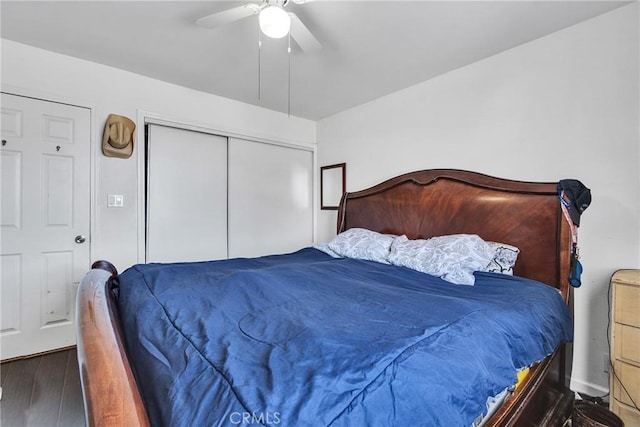 bedroom with a closet, ceiling fan, and dark hardwood / wood-style floors