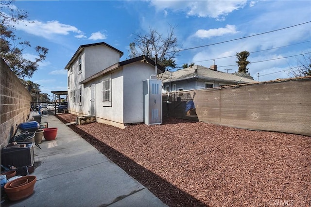 view of property exterior featuring a patio