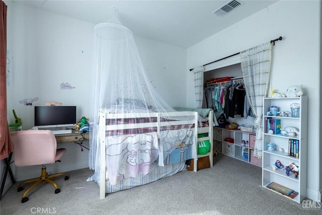 carpeted bedroom with a closet