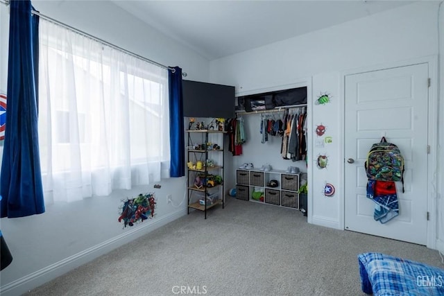 carpeted bedroom with a closet