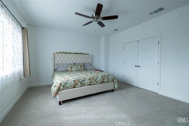 bedroom with carpet floors, a closet, and ceiling fan