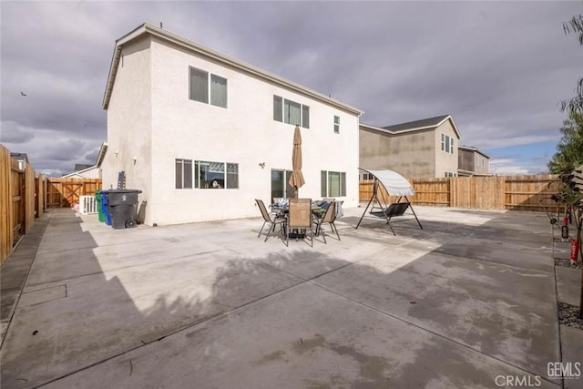 rear view of property with a patio area