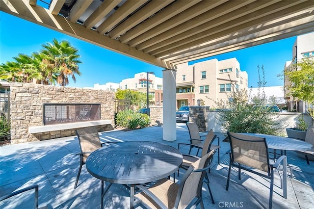 view of patio / terrace with an outdoor stone fireplace