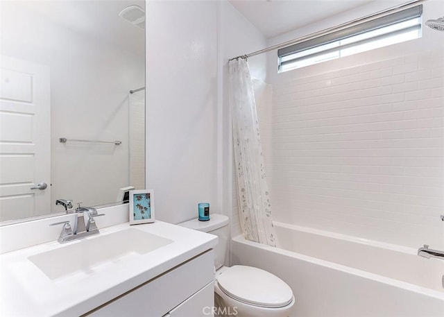 full bathroom with toilet, vanity, and shower / tub combo