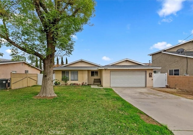 single story home with a front yard and a garage