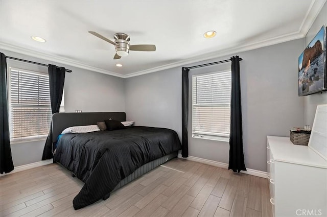 bedroom featuring multiple windows, light wood-type flooring, and ornamental molding