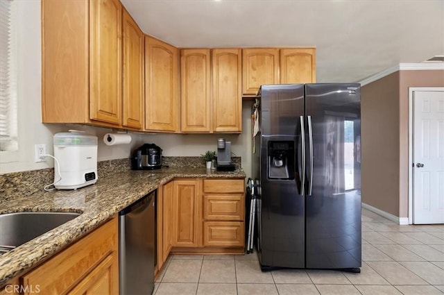 kitchen featuring appliances with stainless steel finishes, crown molding, stone counters, and light tile patterned floors