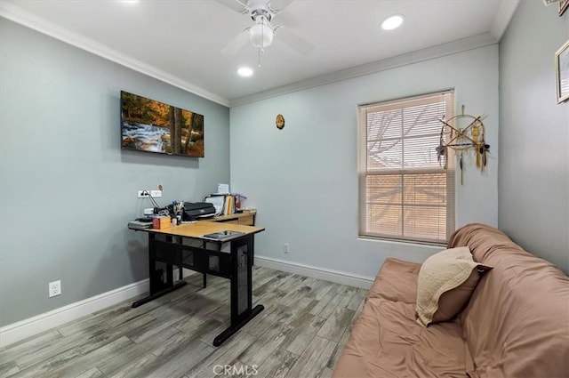 office area with light wood-type flooring, ornamental molding, and ceiling fan