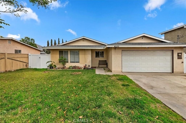 ranch-style house featuring a front yard and a garage