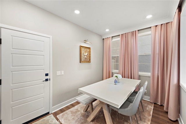 dining area featuring dark wood-type flooring