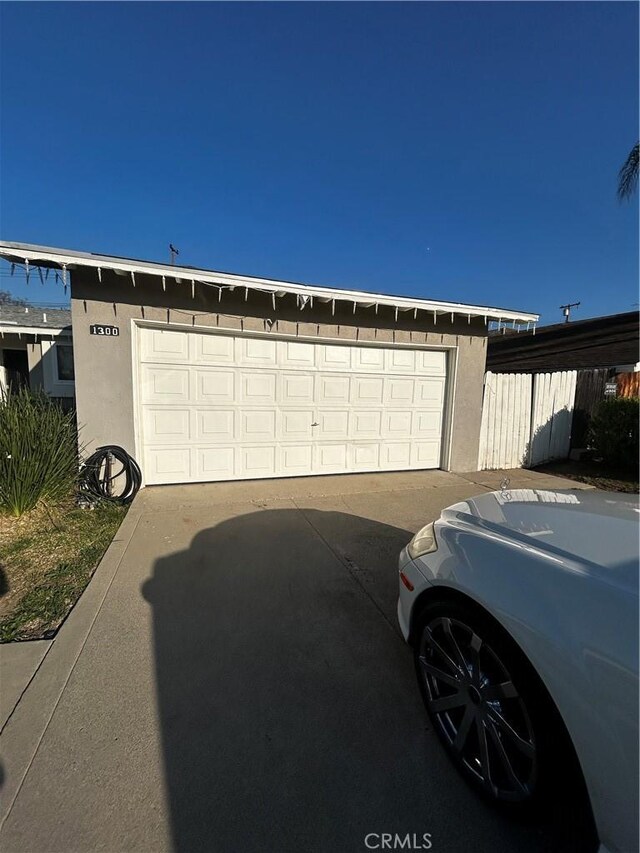 detached garage with fence