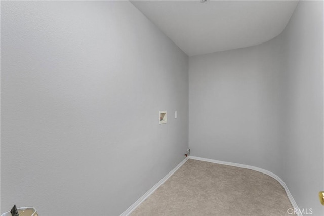laundry area featuring light carpet, laundry area, baseboards, and hookup for a washing machine