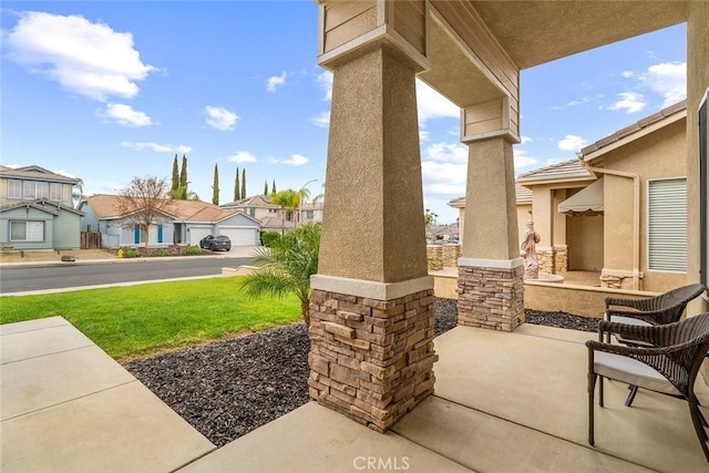 view of patio / terrace featuring a residential view
