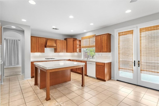 kitchen with visible vents, open shelves, white appliances, recessed lighting, and a kitchen island