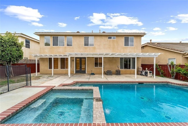 back of property with a pergola, a patio, french doors, and stucco siding
