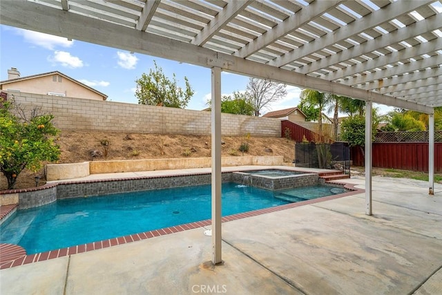 view of pool featuring a patio, a pool with connected hot tub, and a fenced backyard
