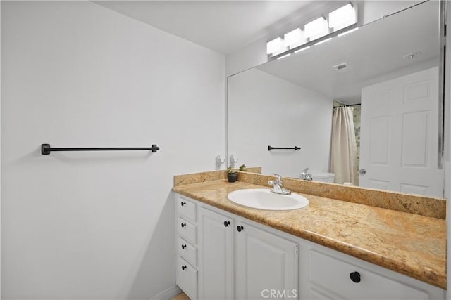 bathroom with vanity and a shower with curtain