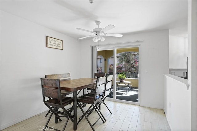 dining room featuring light wood-type flooring and ceiling fan