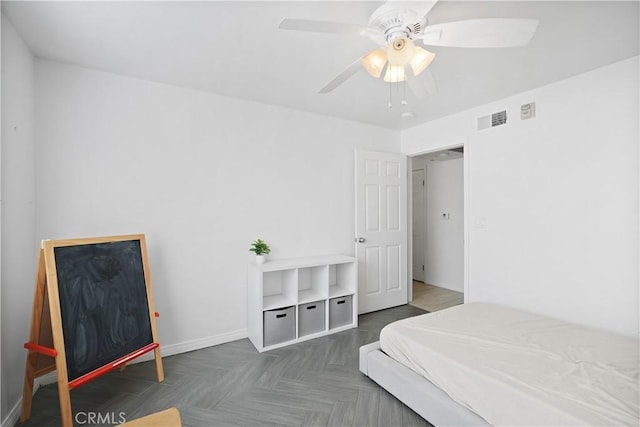 bedroom featuring dark parquet flooring and ceiling fan